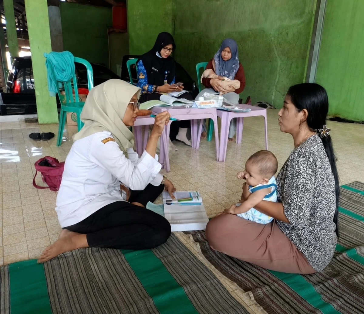 Anggota Pokja 4 melaksanakan Kegiatan Posyandu