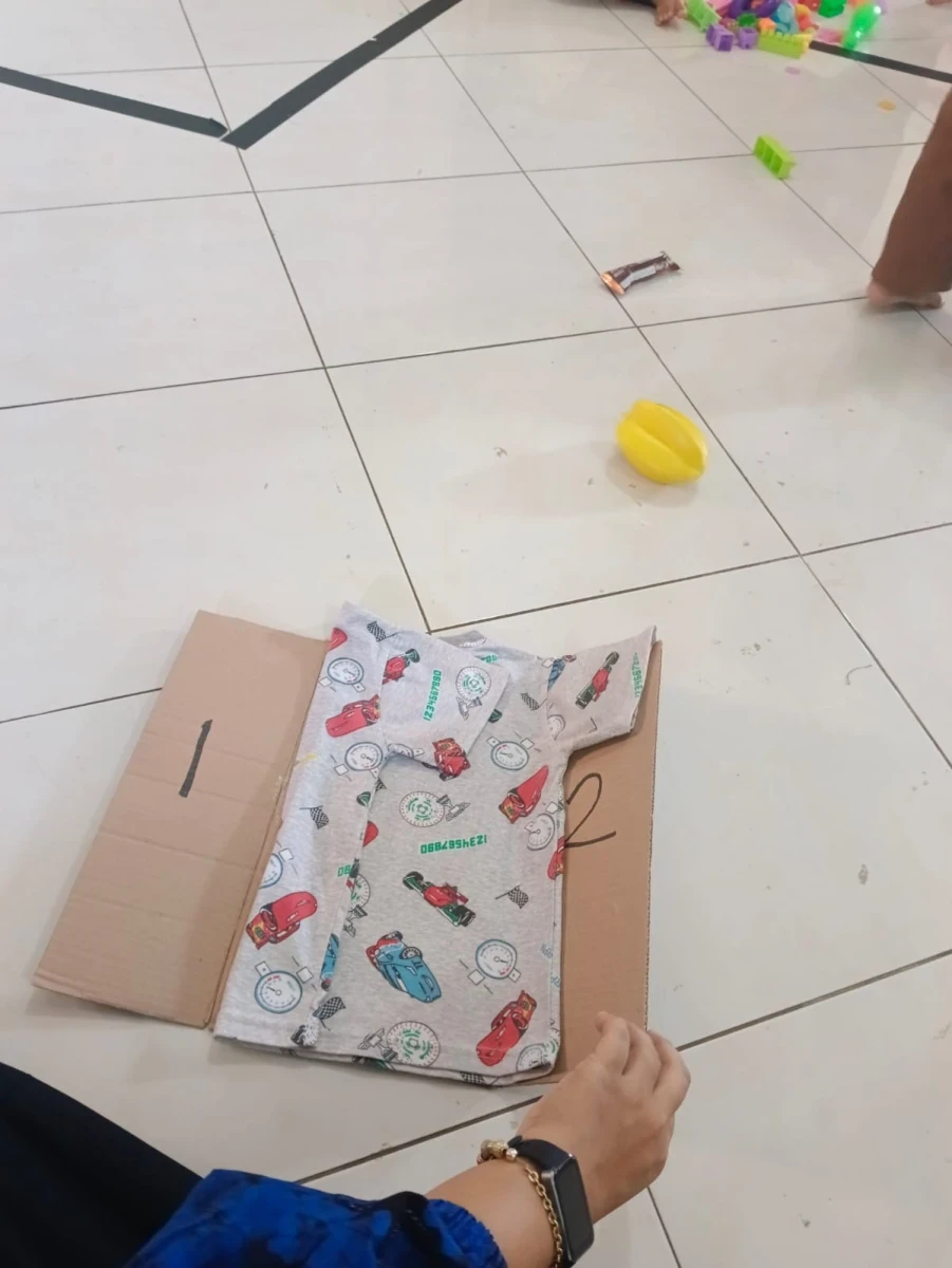 Pos Paud Embun Pagi tema melipat pakaian