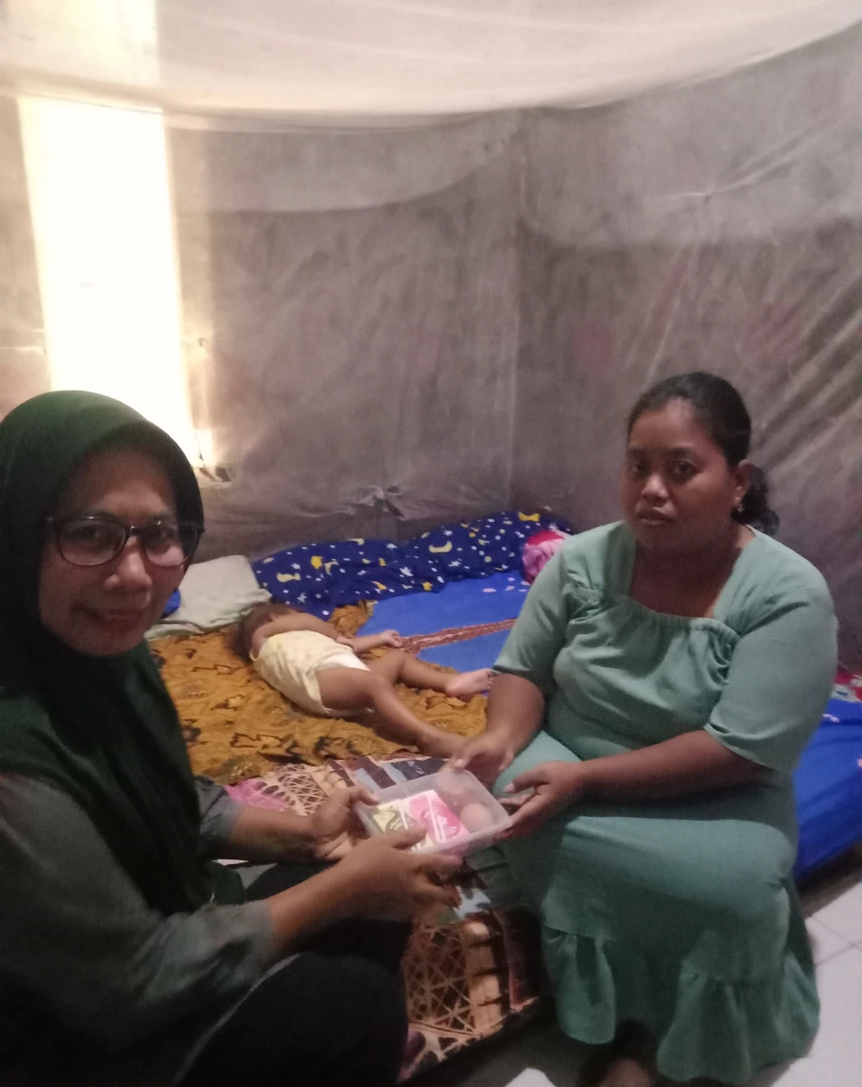 Pemberian PMT Program Genting Minggu ke 8