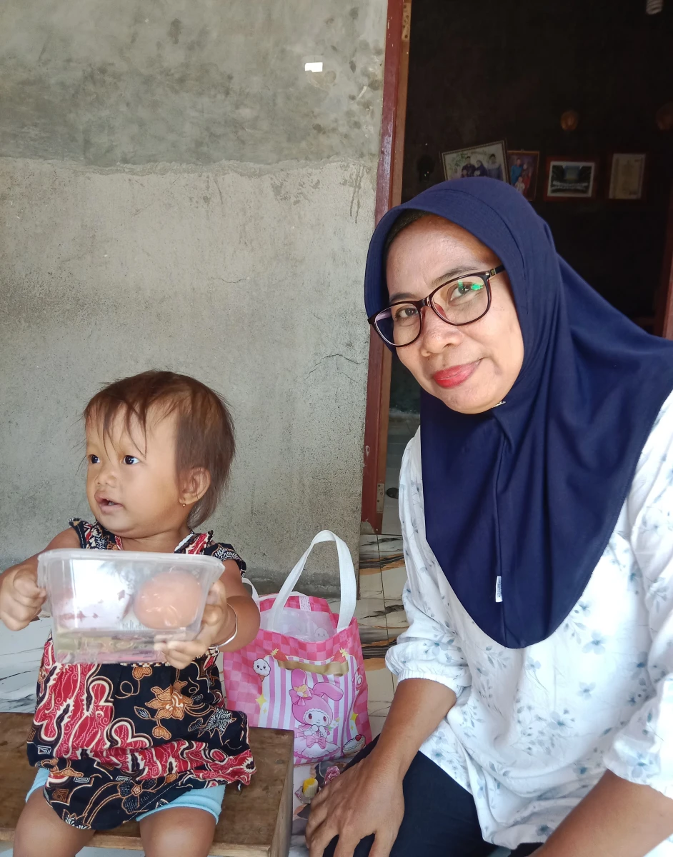 Pemberian PMT Program Genting Minggu ke 11